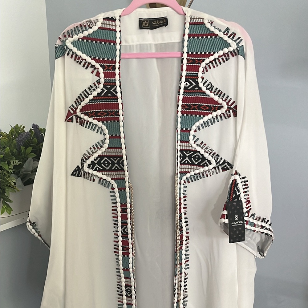 Middle eastern abayeh over dress